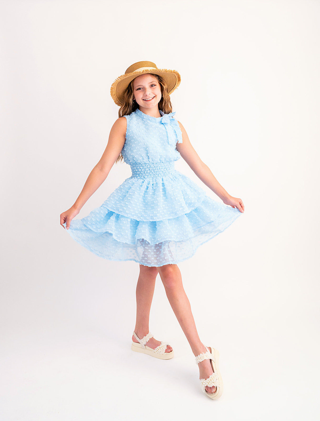 Butterfly Kisses Cloud Blue Dotted Simplicity Dress with Neck Bow Detail, Smocked Waist, and Tiered Ruffle Skirt as
