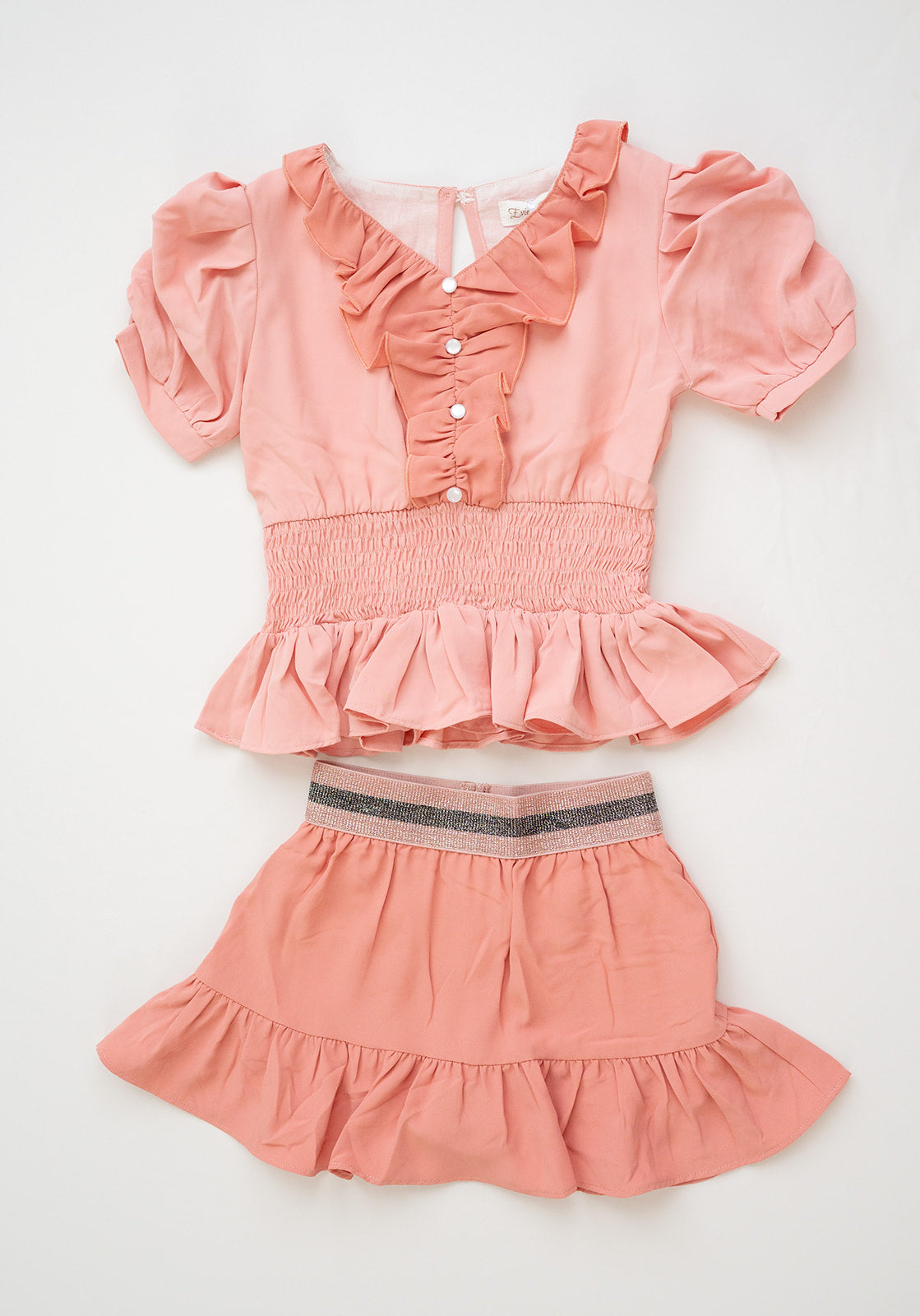 The Lord's Promise Blush and Coral Ruffle Button Accent Peplum Smocked Top and Coordinating Stretchy Metallic Waist Skort